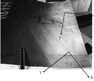 fragment of thin-walled large component deformed as a result of HTT